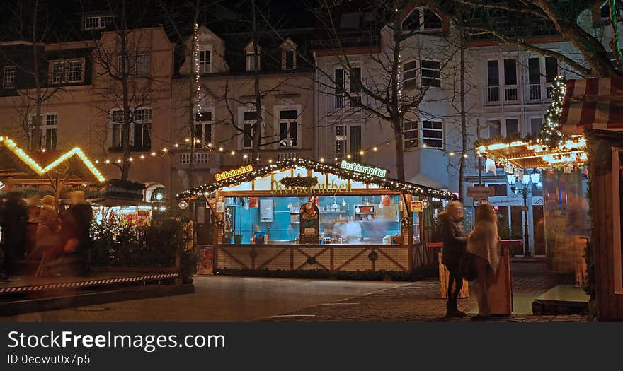 Time exposure but with a drink people stand still for a minute. Time exposure but with a drink people stand still for a minute