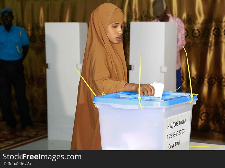 A Delegate votes during the electoral process to choose members of the House of the People in Cadaado, Somalia on December 06, 2016. AMISOM Photo. A Delegate votes during the electoral process to choose members of the House of the People in Cadaado, Somalia on December 06, 2016. AMISOM Photo