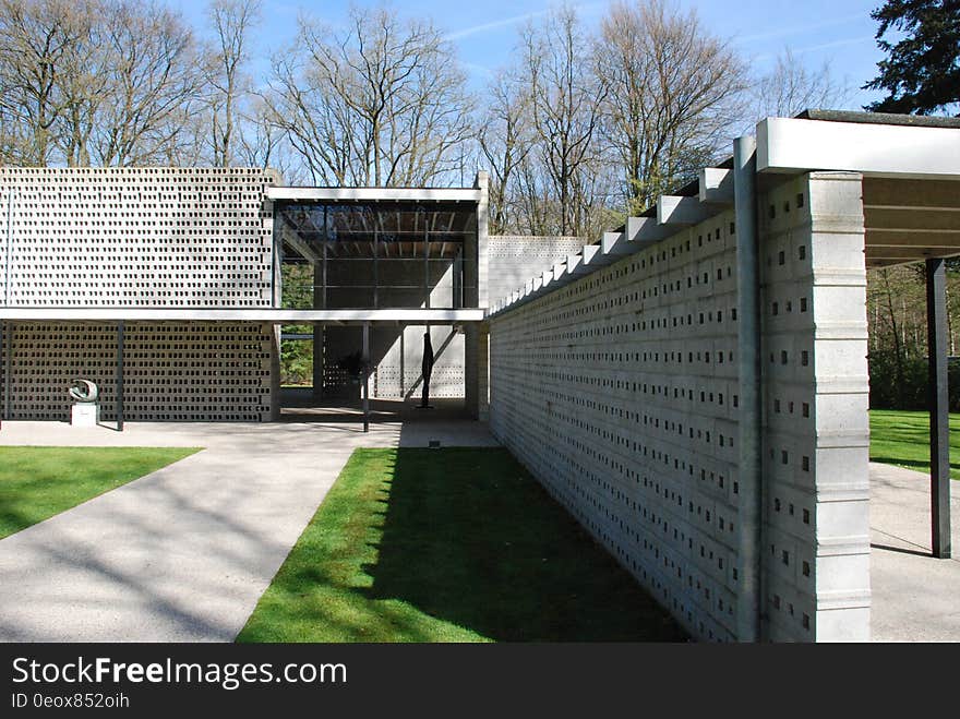 Modern home with brick walls and yard with cinder block fence. Modern home with brick walls and yard with cinder block fence.