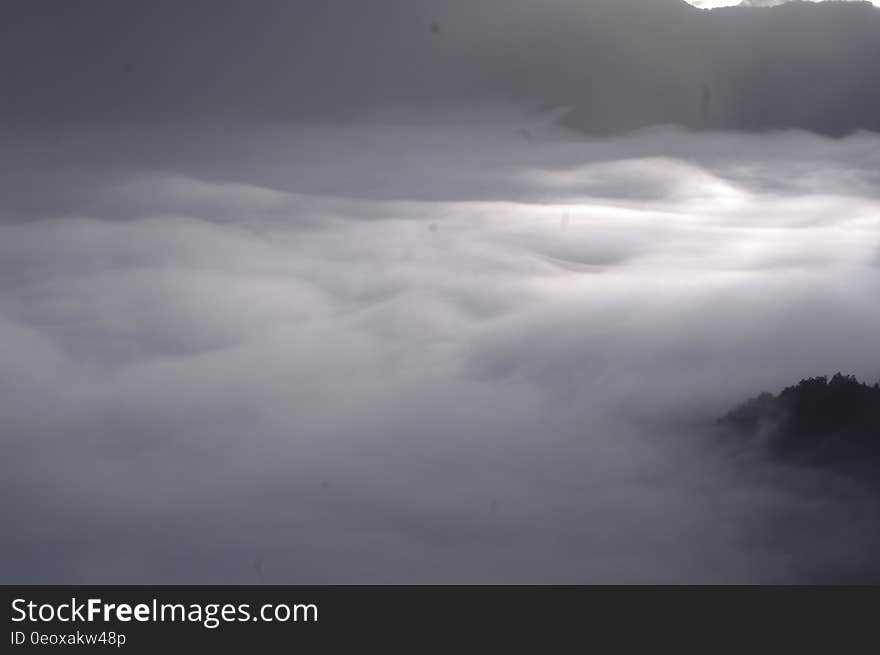 Scenic view of a white cloudscape over mountain range.