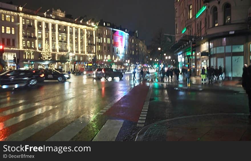 Nighttime scene of urban street illuminated with traffic. Nighttime scene of urban street illuminated with traffic.