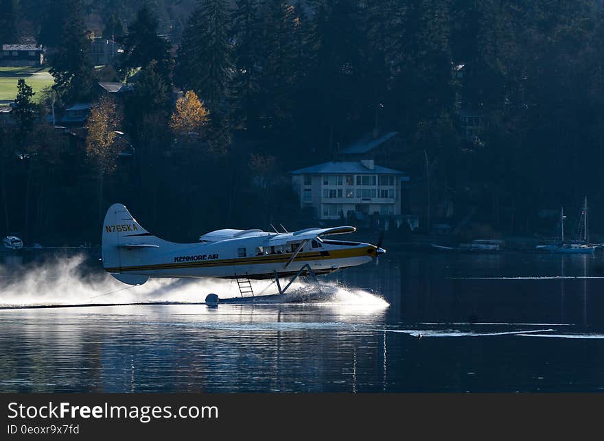 Seaplane on take off or landing on sunny day. Seaplane on take off or landing on sunny day.