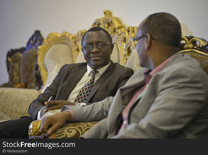 AMISOM Senior Political Affairs Officer, Haji Ssebirumbi Kisinziggo, speaks with Deputy Chairman of Somalia&#x27;s National Independent Electoral Commission, Sayid Ali Sh. Mohamed, after his return from Ghana to Mogadishu on December 11, 2016. AMISOM Photo / Tobin Jones. AMISOM Senior Political Affairs Officer, Haji Ssebirumbi Kisinziggo, speaks with Deputy Chairman of Somalia&#x27;s National Independent Electoral Commission, Sayid Ali Sh. Mohamed, after his return from Ghana to Mogadishu on December 11, 2016. AMISOM Photo / Tobin Jones