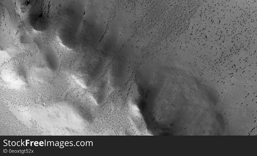 Monochrome photo of a bleak, rocky landscape on Mars.