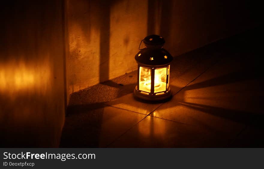 Close up of lantern burning at night.