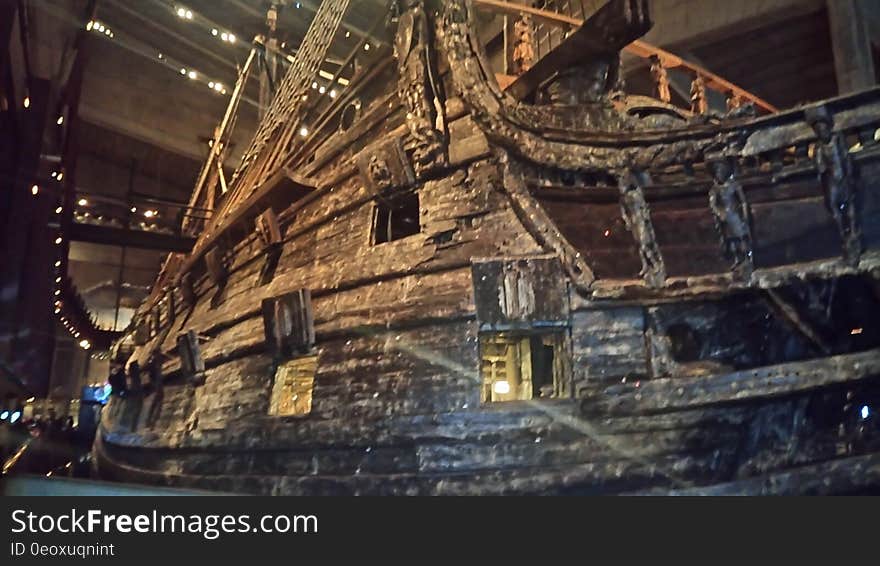 Wooden ship on display inside museum hall. Wooden ship on display inside museum hall.