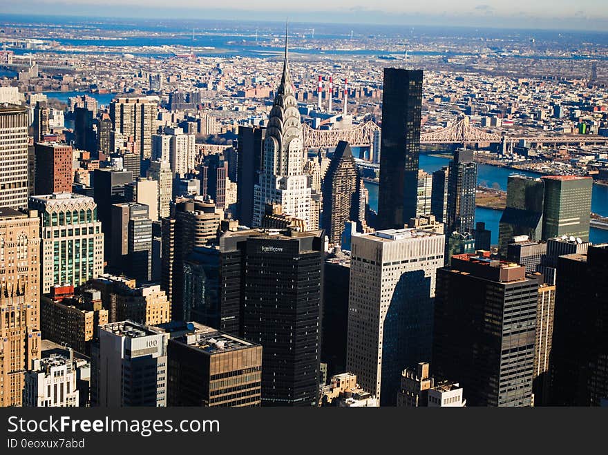 Urban skyline from aerial view along skyscrapers on sunny day. Urban skyline from aerial view along skyscrapers on sunny day.