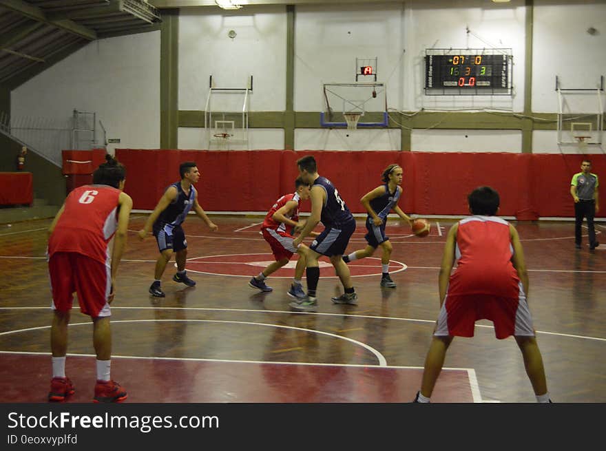 Players during basketball game on indoor gymnasium court. Players during basketball game on indoor gymnasium court.