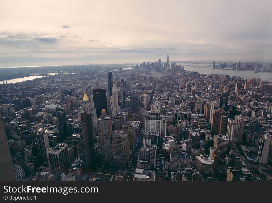 Aerial view of modern buildings along waterfront of large city. Aerial view of modern buildings along waterfront of large city.