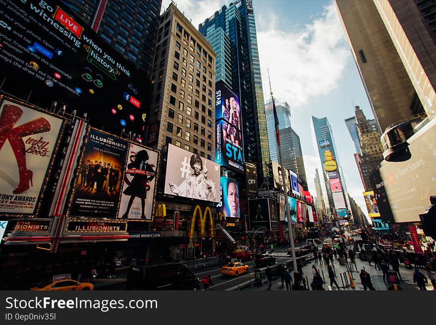 Times Square in New York City, NY on sunny day. Times Square in New York City, NY on sunny day.