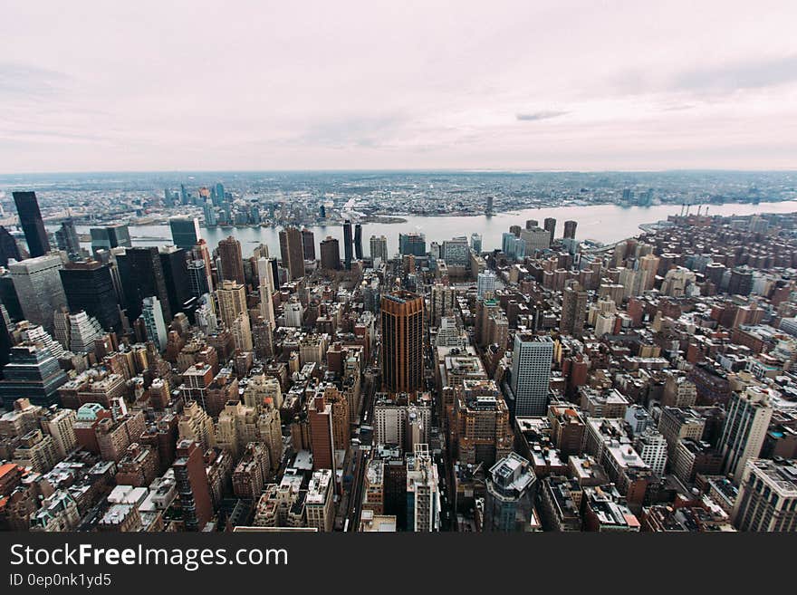 Aerial view of waterfront city skyline with pink skies. Aerial view of waterfront city skyline with pink skies.