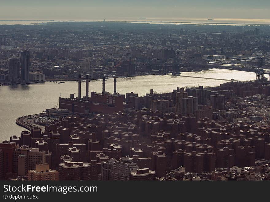 Aerial view of urban waterfront at sunset.