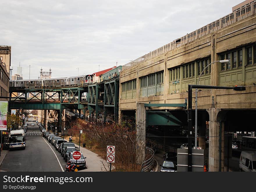 Raised train platform over urban streets on overcast day. Raised train platform over urban streets on overcast day.