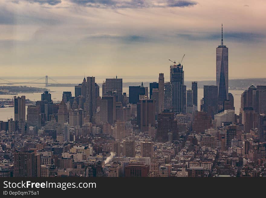 Manhattan, New York skyline against cloudy skies. Manhattan, New York skyline against cloudy skies.