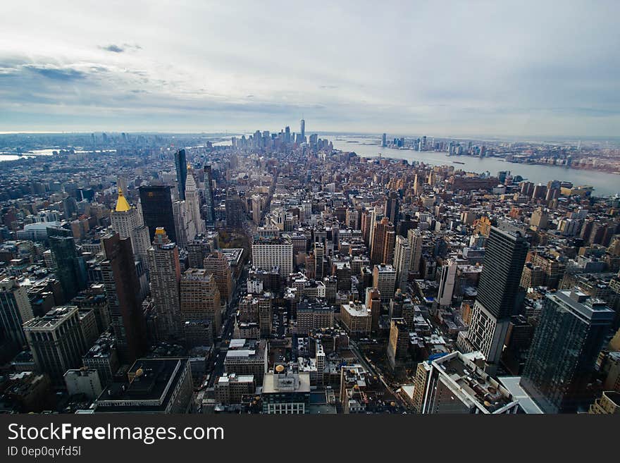 Aerial view over rooftops on Manhattan, New York along waterfront. Aerial view over rooftops on Manhattan, New York along waterfront.