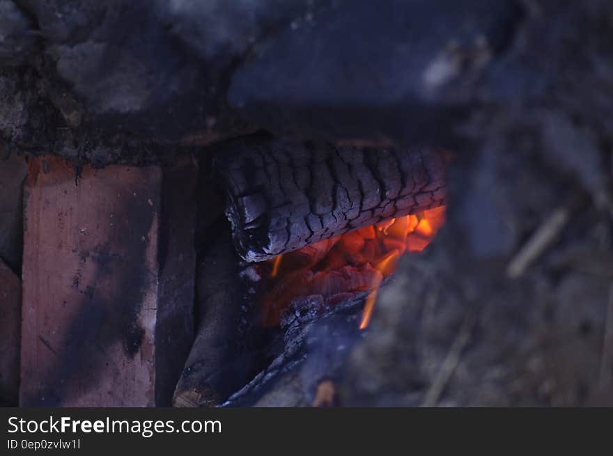 Close up of glowing embers in wood fire. Close up of glowing embers in wood fire.