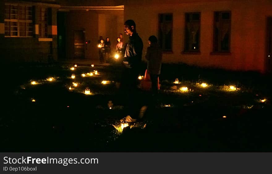 Lanterns burning on tables indoors. Lanterns burning on tables indoors.