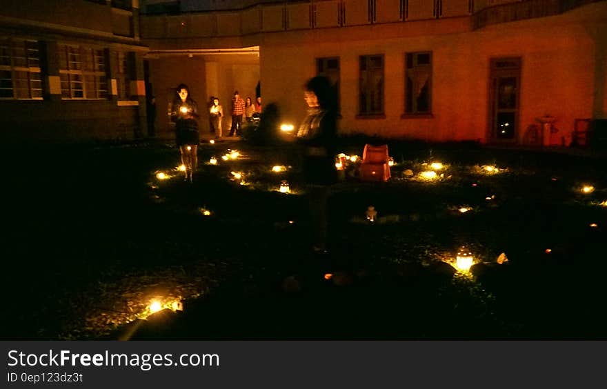 Indoor tables illuminated with candles.