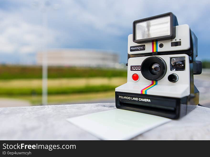 Tilt Shift Photography of Polaroid Land Camera on White Table