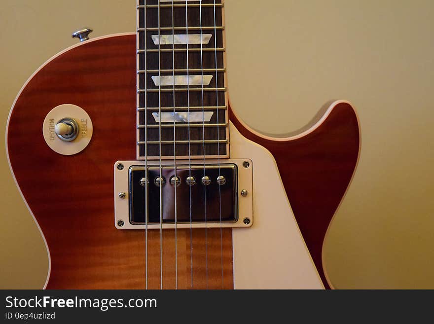 Brown and White Les Paul Guitar