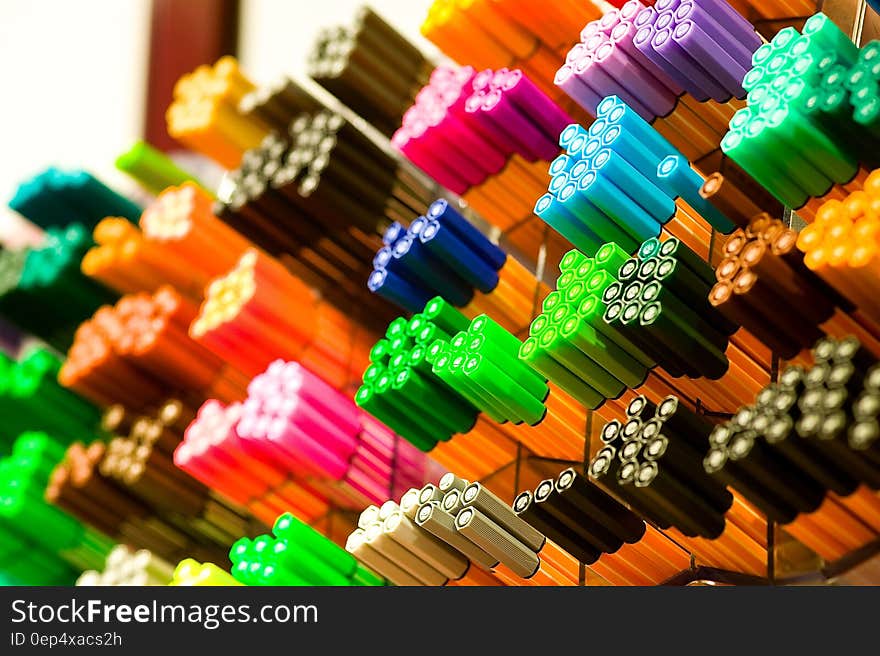 Focus Photography of Colored Pens