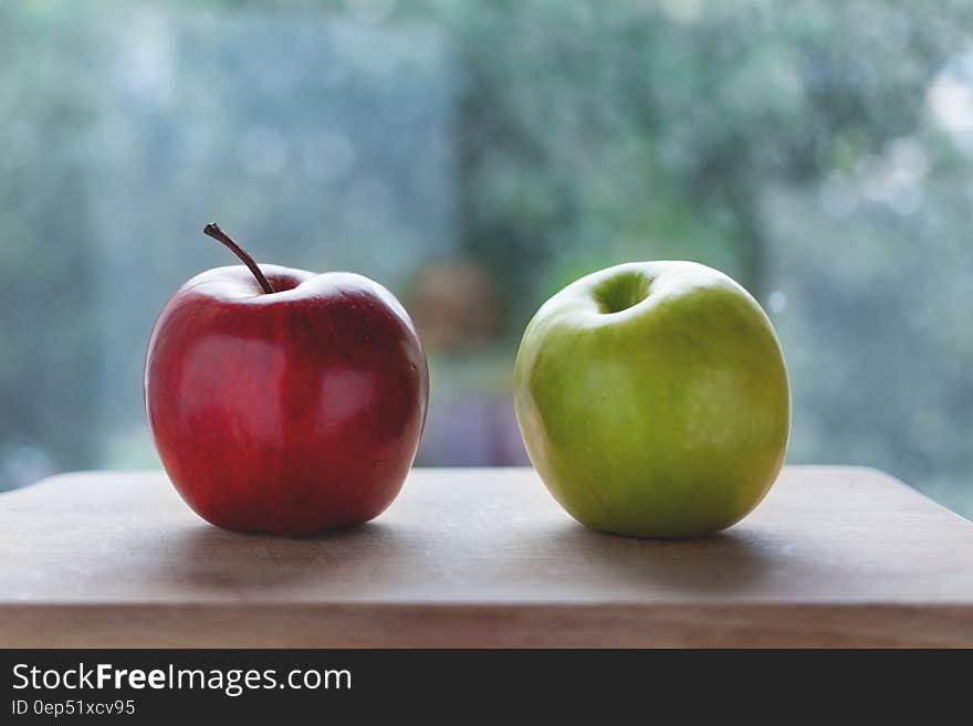Red Apple Beside the Green Apple