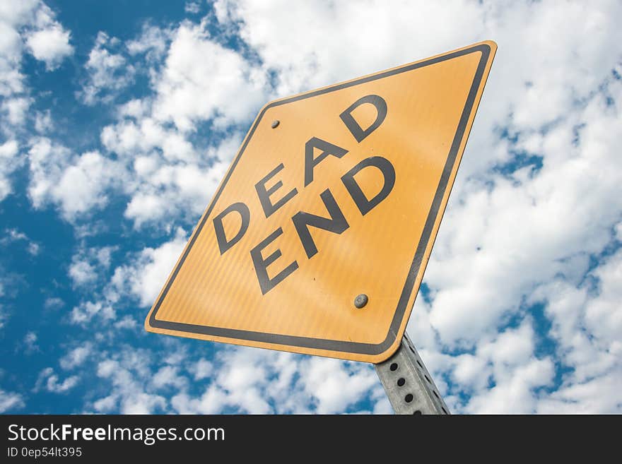 Yellow Dead End Sign during Day Time