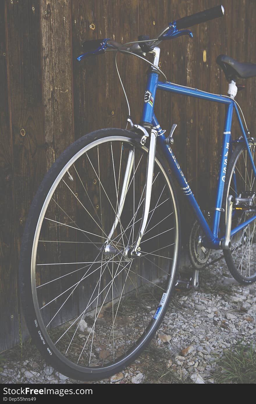 Blue City Bike Beside Brown Wooden Fence