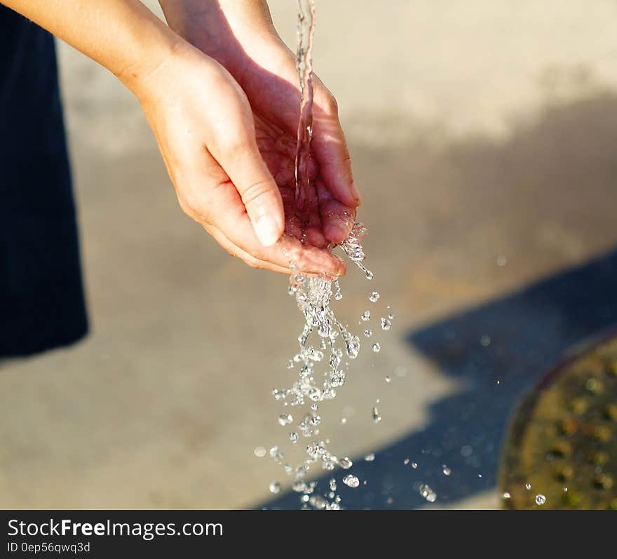 Water Pouring on Person&#x27;s Hand