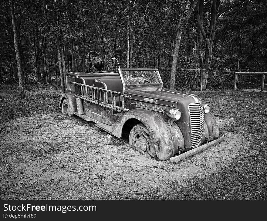 Gray Scale Photo of Vintage Car