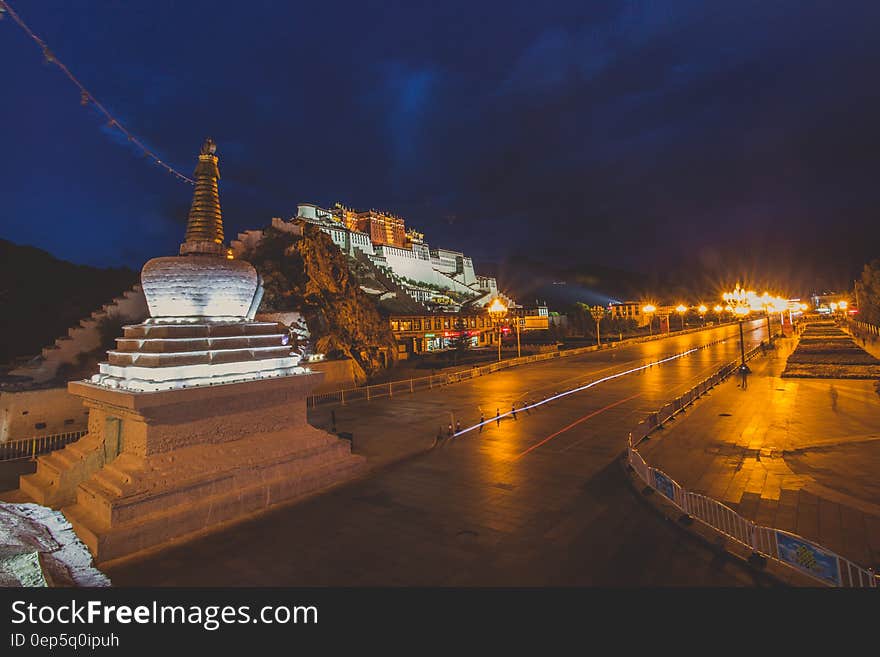 Night scene of street in front of hillside palace illuminated. Night scene of street in front of hillside palace illuminated.