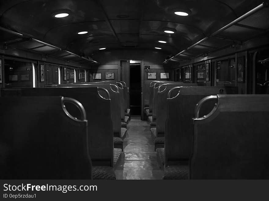 Grayscale Photography of Train Car Interior