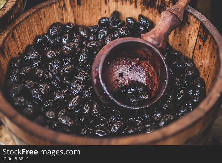 Close up Photography of Black Berry in Brown Wooden Container