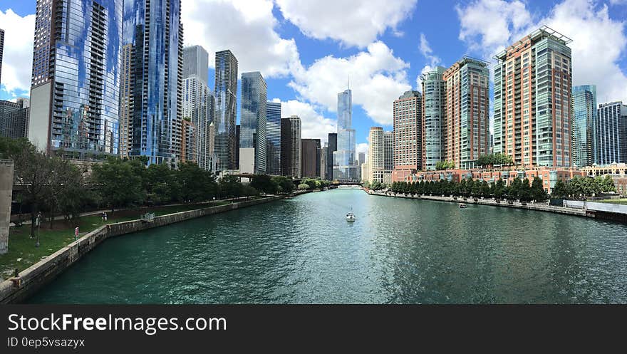 City With River in Middle during Cloudy Day