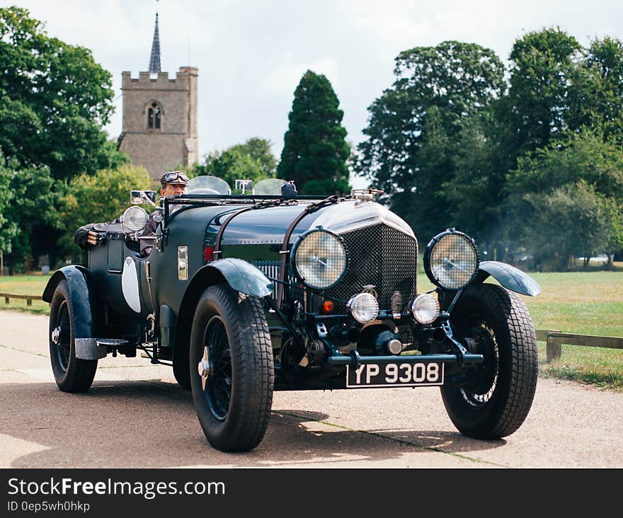 A classic Bentley 3.5 Litre convertible on a road.