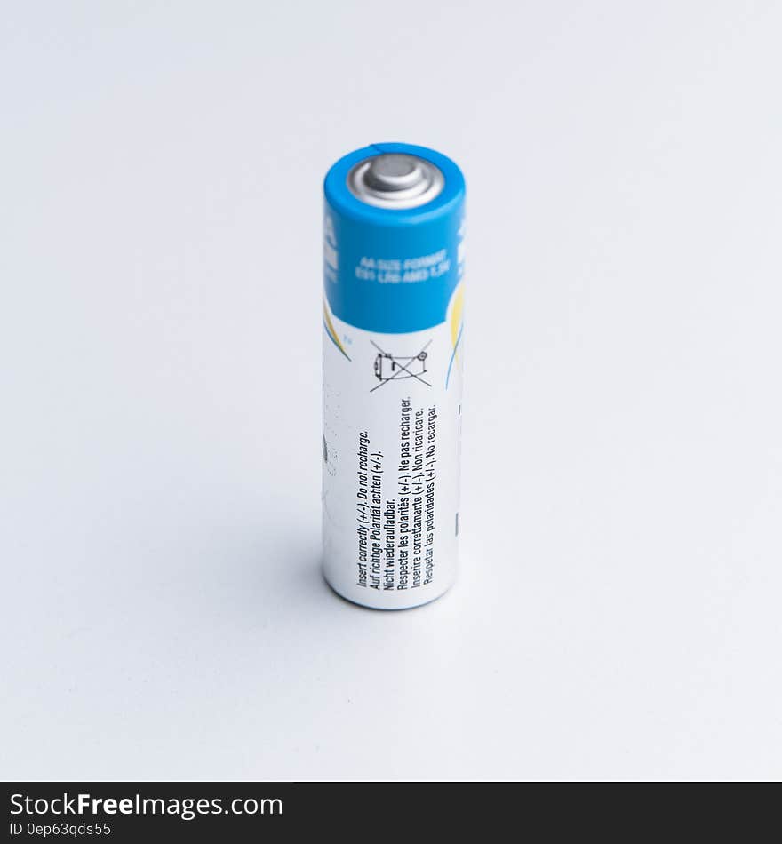 Close up of blue and white aa or aaa battery on white. Close up of blue and white aa or aaa battery on white.