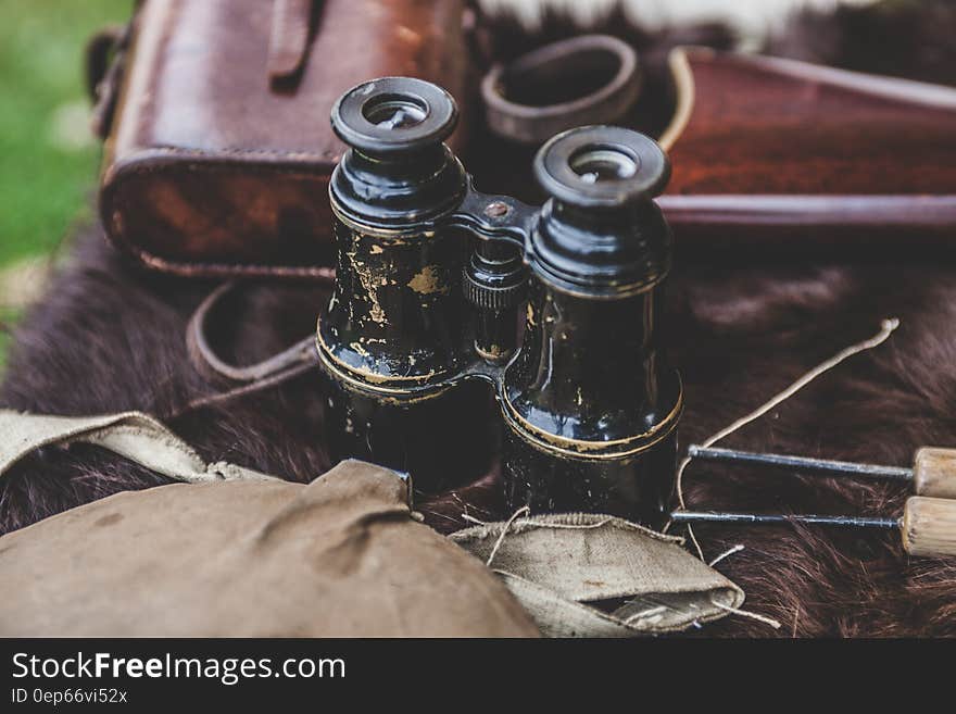 Brown Binoculars on Brown Textile