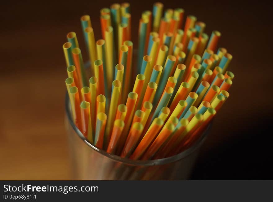 Colorful Plastic Straw on a Glass Container