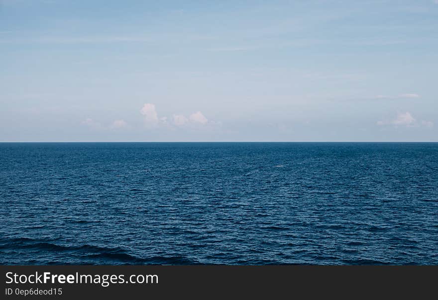 Water horizon against blue skies on sunny day. Water horizon against blue skies on sunny day.