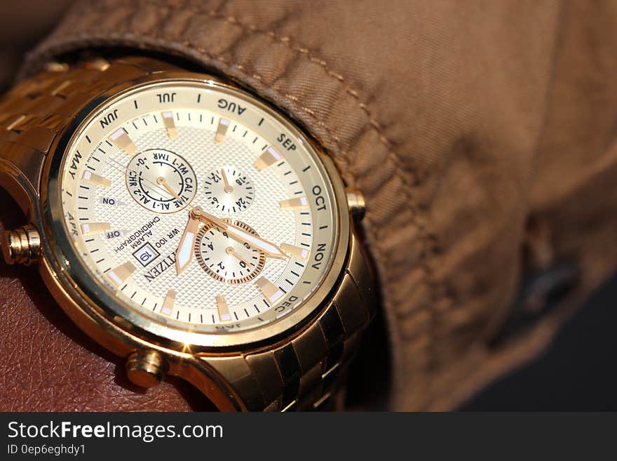 Person Wearing Silver Linked Chronograph Watch