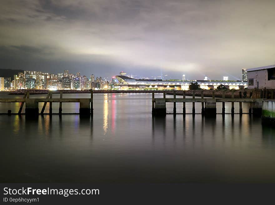 Cityscape View over Sea With Lights Turned on during Night