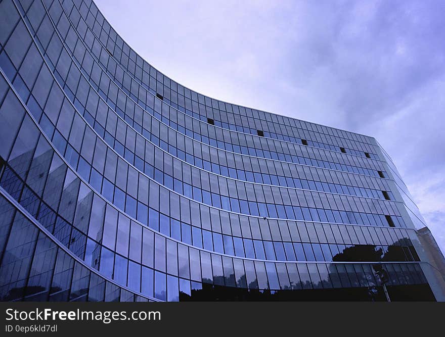 Fish Eye View Photo of Glass High Story Building over White Cloudy Sky during Daytime