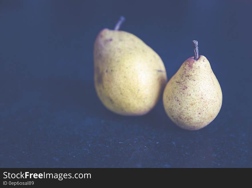 Tilt Shift Photo of Two Pears