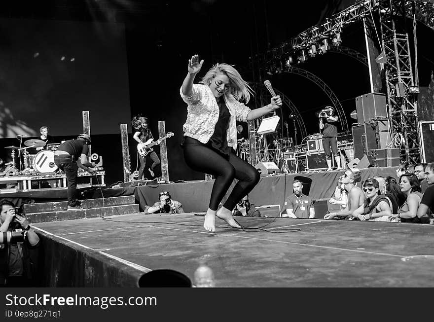 Women Dancing on Stage in Gray Scale Photography