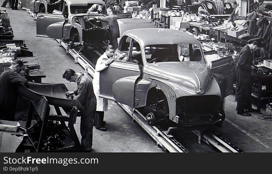 Gray Scale Photo of Car Factory