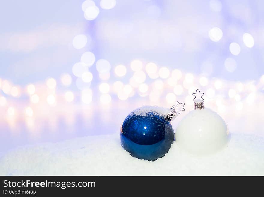 Blue Round Christmas Ornament on Snow