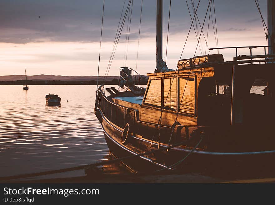 Photo of Ship on Water during Sunset