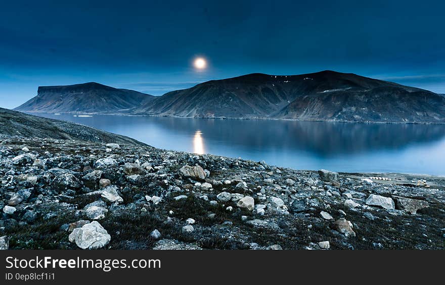 Island Mountain Near Rock Formation during Night Time