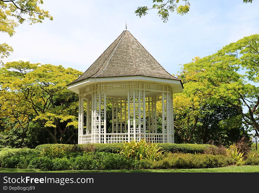 White Wooden Shed in the Middle of the Park during Day Time