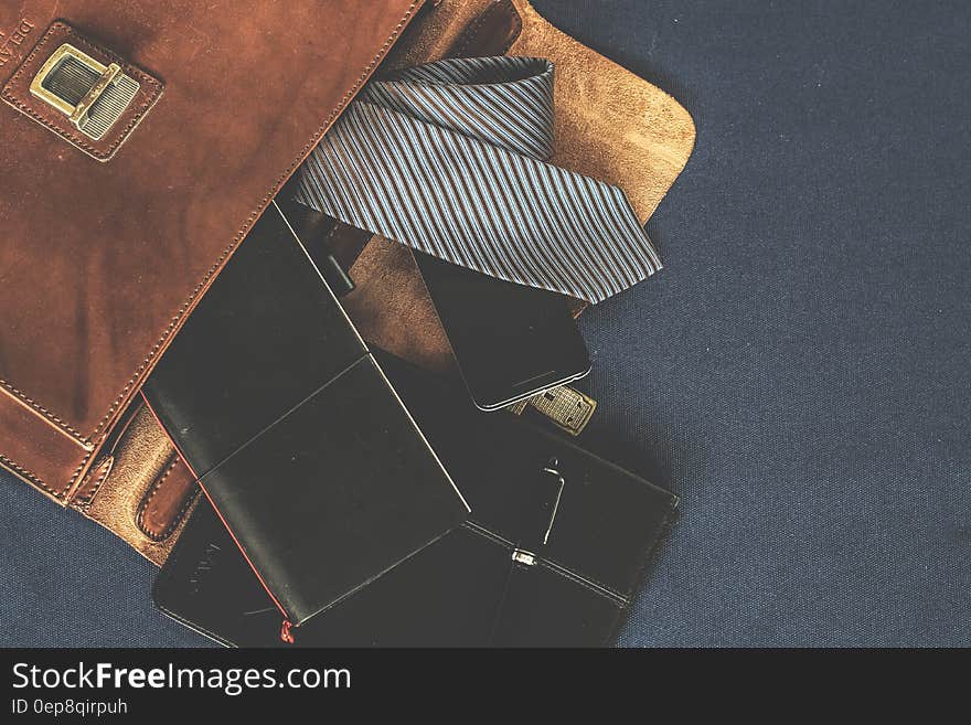 Black Leather Wallet Near the Necktie